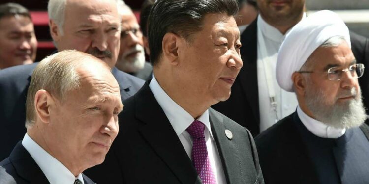 Vladimir Putin, Xi Jinping e Hassan Rouani (LaPresse)