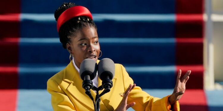 American poet Amanda Gorman reads a poem during the 59th Presidential Inauguration at the U.S. Capitol in Washington, Wednesday, Jan. 20, 2021. (AP Photo/Patrick Semansky, Pool)